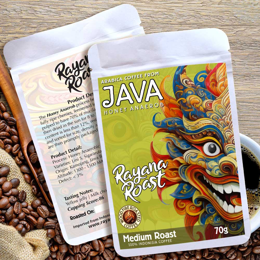 Two coffee packages from Rayana Roast on a wooden surface with coffee beans.