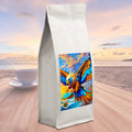 Coffee bag with Garuda's Crimson label on a beach sunset background
