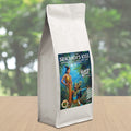 Coffee bag labeled 'Srikandi's Kiss' with a scenic design on a blurred natural background