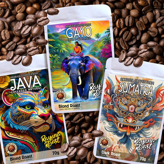 Three coffee packages with colorful designs on a bed of coffee beans